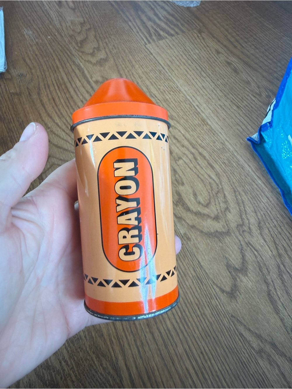 Vintage tin crayon holder in orange